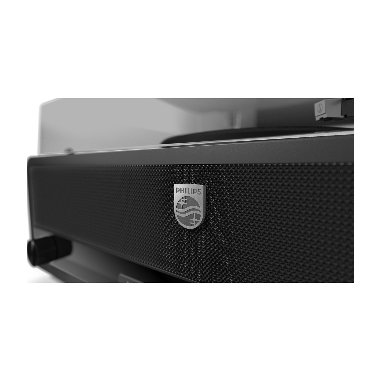 Primo piano di un giradischi Philips nero. Il logo Philips è visibile. Il lettore ha una superficie strutturata e un'emblema argentato.