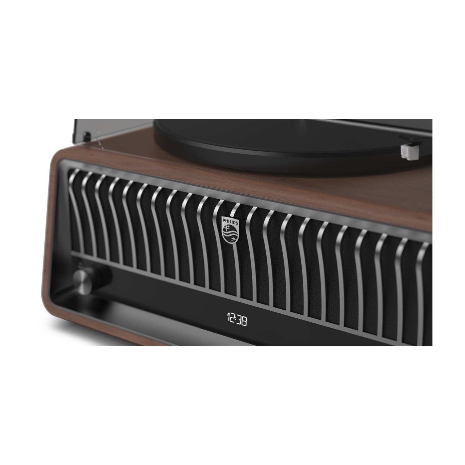 Uno stereo Philips in stile vintage. Ha una finitura in legno, una parte superiore nera con giradischi e un display digitale che mostra 12:38.