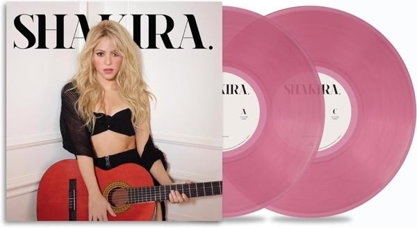 Shakira-Albumcover mit ihr, die eine Gitarre hält, neben zwei rosa Schallplatten. Sie trägt Schwarz und hat blonde Haare.