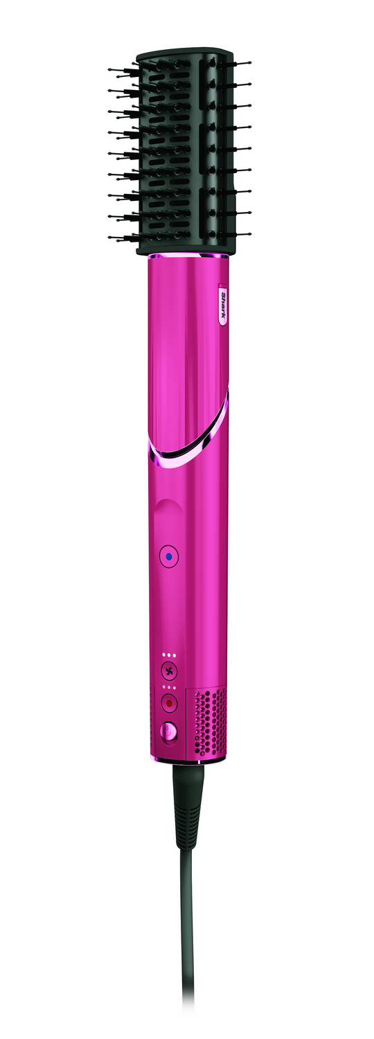Un cepillo de peinado rosa y negro con un cable de alimentación negro sobre un fondo blanco.