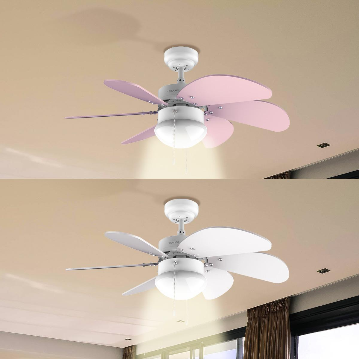 Dos ventiladores de techo. Uno con aspas rosas y otro con blancas. Ambos tienen una lámpara abajo y están montados en un techo beige.