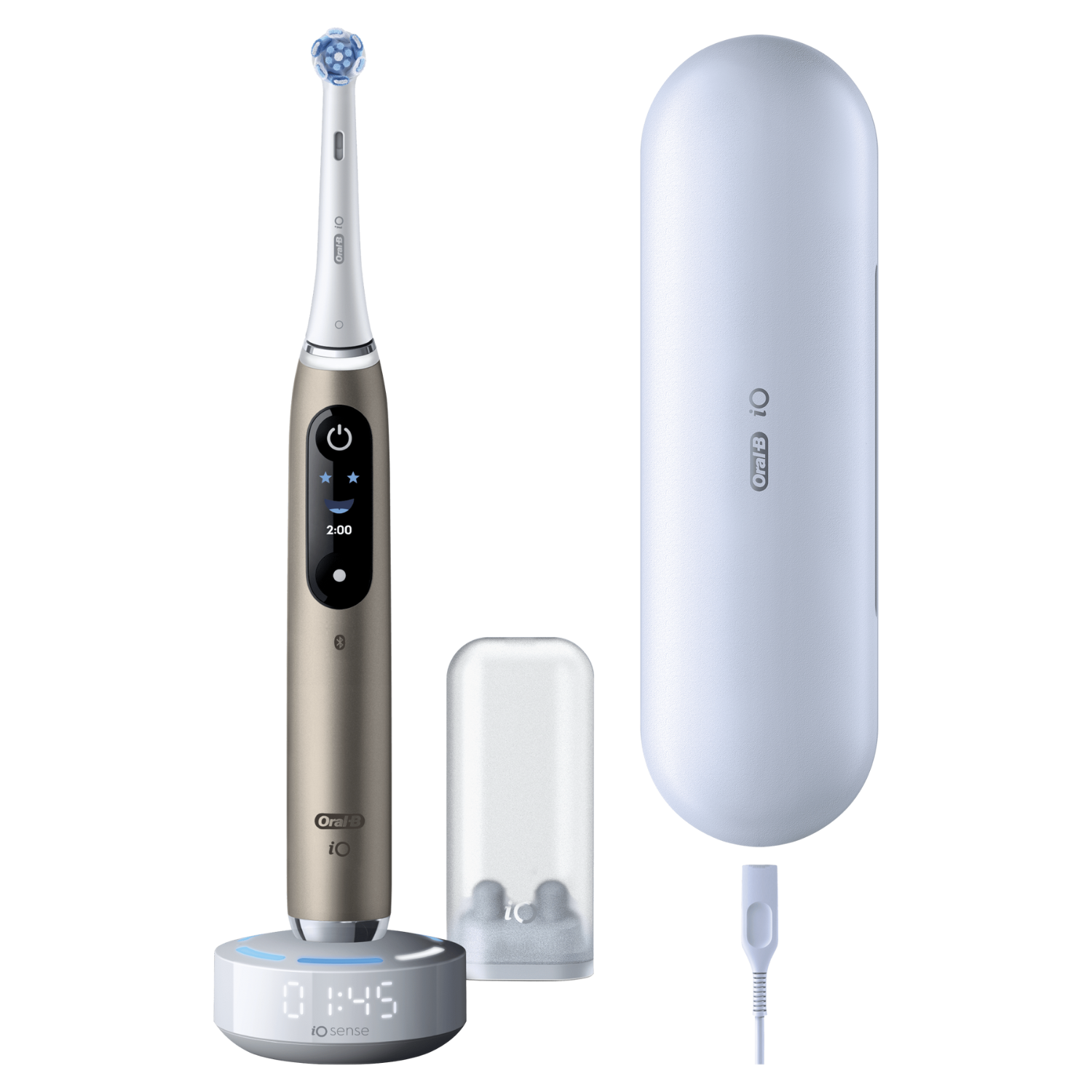 Un cepillo de dientes eléctrico Oral-B iO con cargador, estuche y estuche para cabezales. El cepillo es dorado y tiene una pantalla digital.