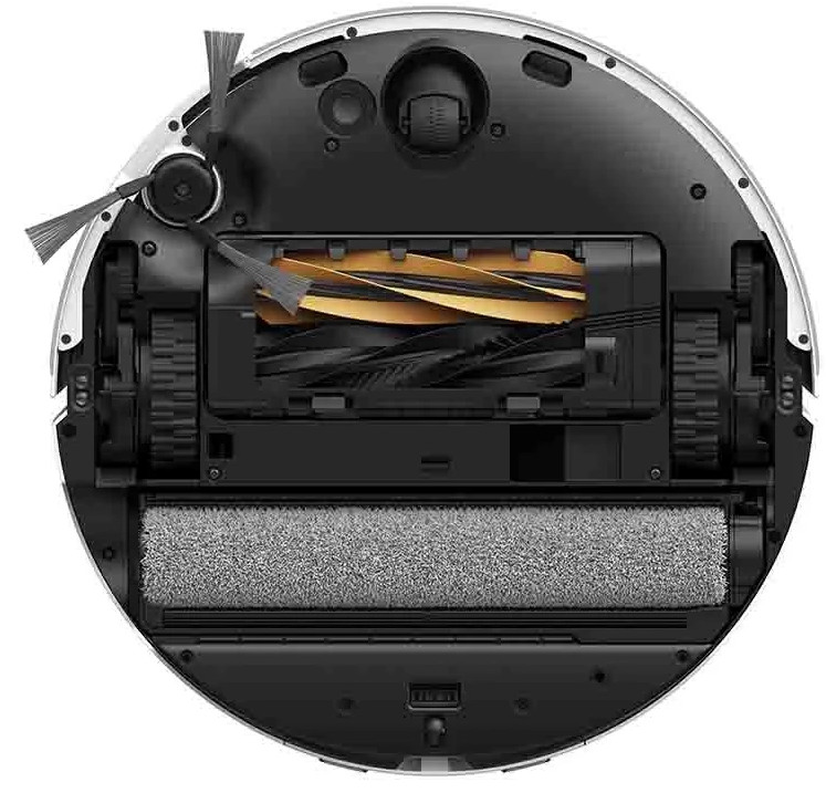 Widok od spodu robota sprzątającego. Zawiera szczotki, wałek, koła i port ładowania w okrągłym kształcie.