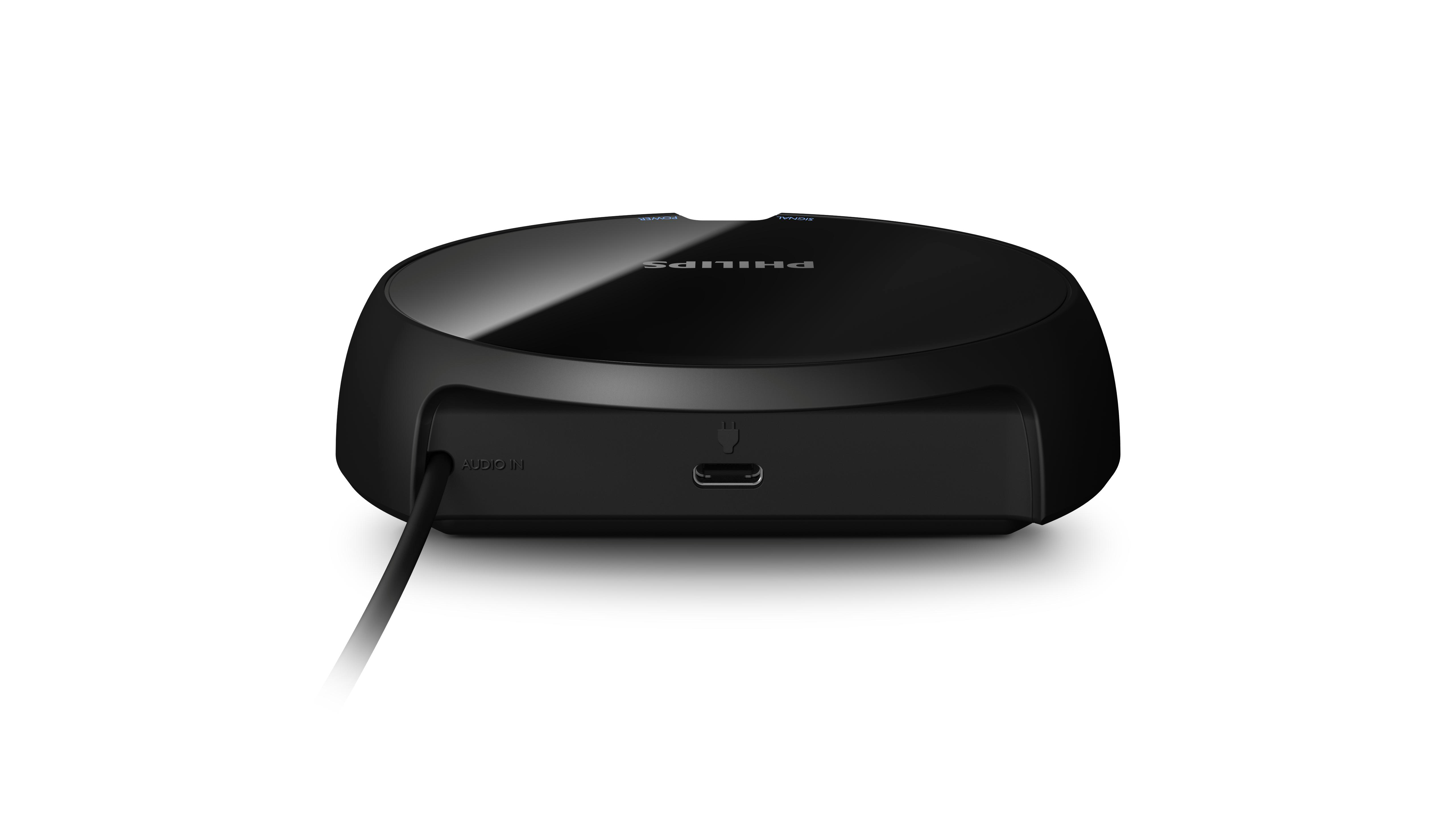 Ein schwarzes Philips-Gerät mit glänzender Oberseite. Es hat einen USB-Anschluss und einen Audioeingang. Ein schwarzes Kabel ist befestigt.