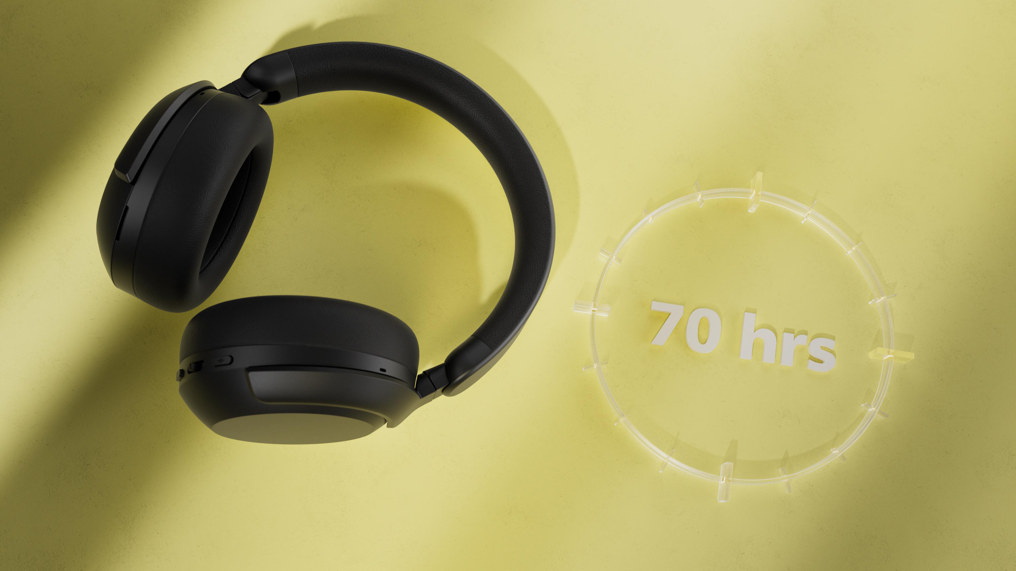 Schwarze Kopfhörer auf gelbem Hintergrund mit einem transparenten Kreis, der "70 hrs" anzeigt. Schatten erzeugen Tiefe.