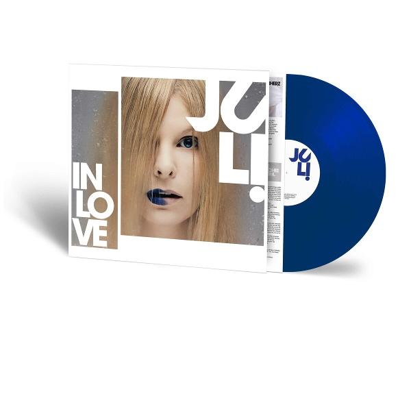 Albumcover: Frau mit blonden Haaren und blauem Lippenstift. Schallplatte ist dunkelblau.
