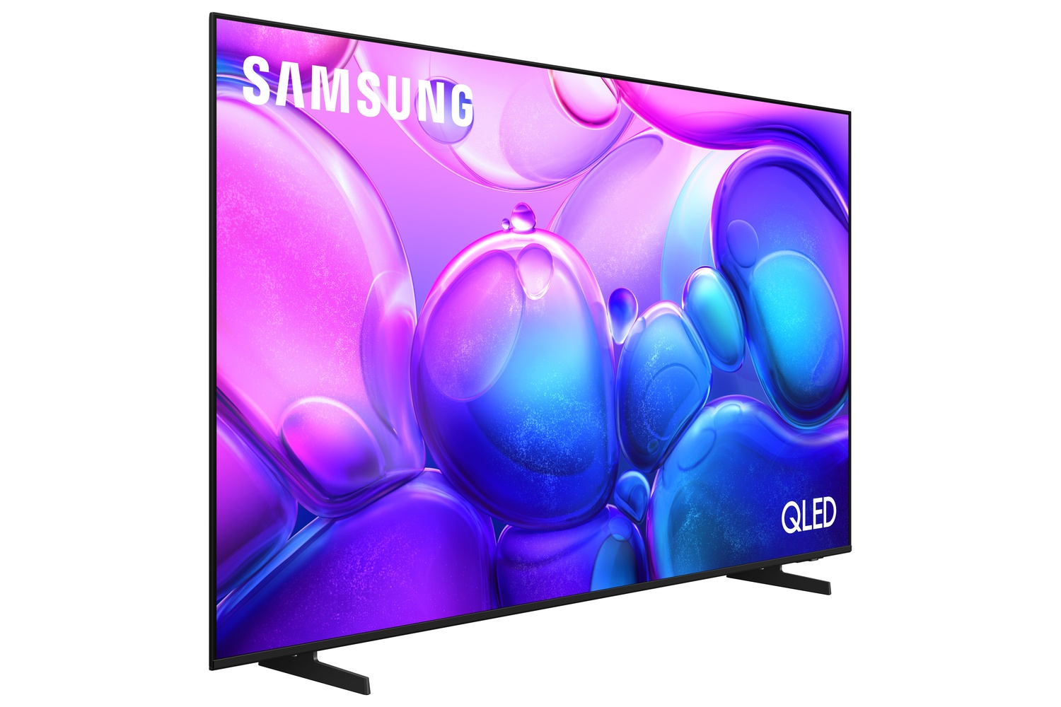 Un televisor Samsung QLED muestra una imagen abstracta colorida de burbujas azules y moradas. El televisor es negro y se apoya en patas negras.
