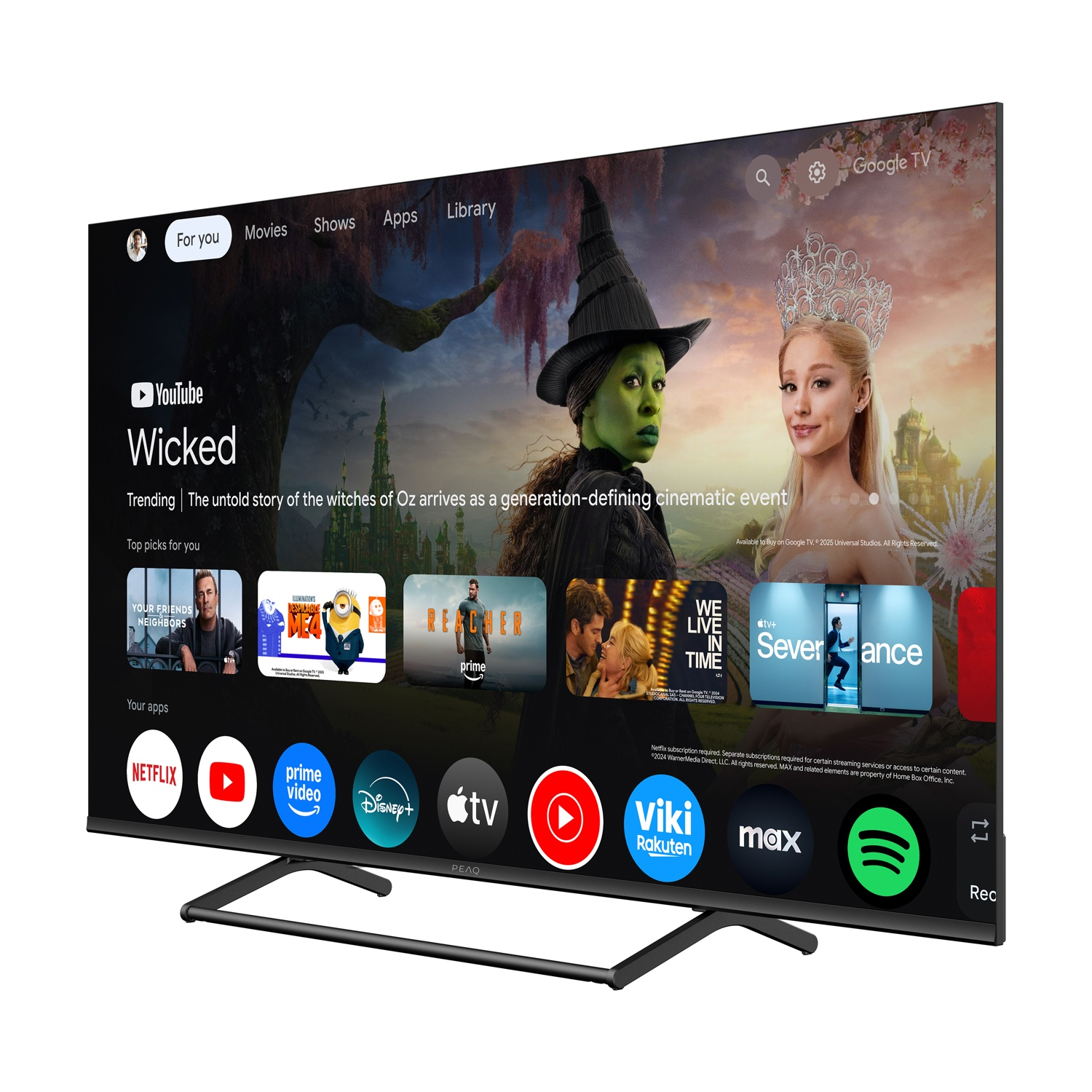 Uno schermo TV mostra il film "Wicked", con una strega verde e una donna bionda. Sono mostrate app come Netflix e YouTube.