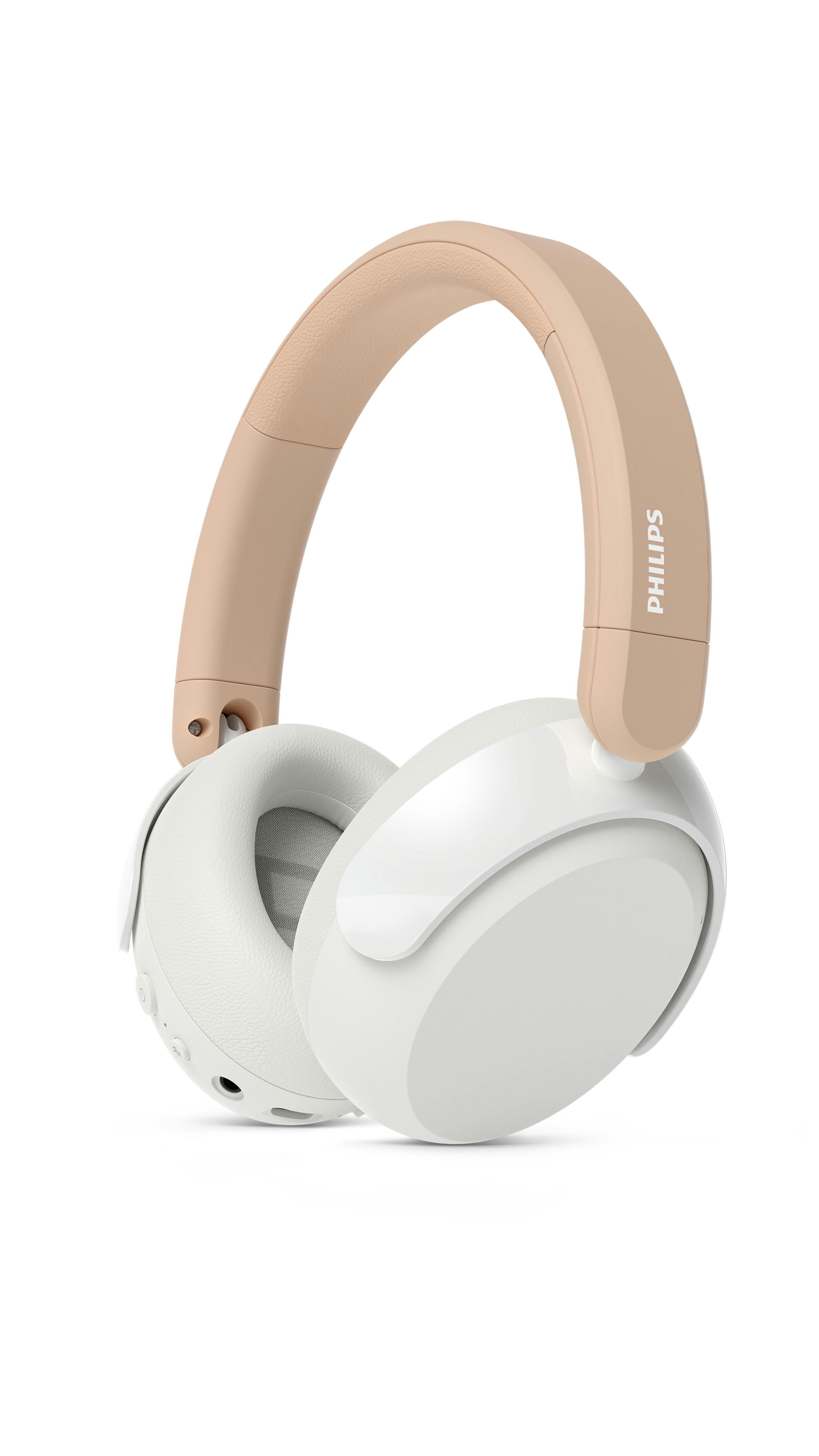 Creme- und weiße Philips-Kopfhörer. Das Kopfband ist cremefarben und die Ohrmuscheln weiß. Der Hintergrund ist weiß.