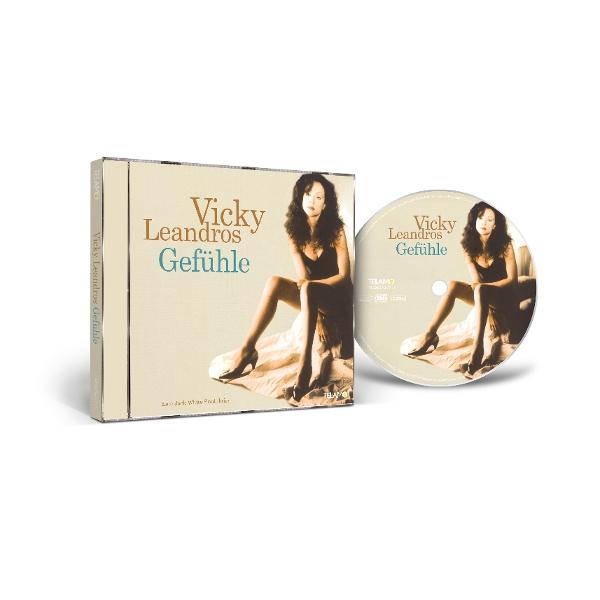 CD-Hülle und -Scheibe des Albums 'Gefühle' von Vicky Leandros. Eine Frau in einem schwarzen Kleid sitzt auf einem Bett. Hülle und Scheibe sichtbar.