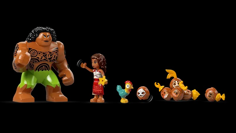 Lego set with Maui, Moana, a chicken, and several coconut-like characters. Black background.