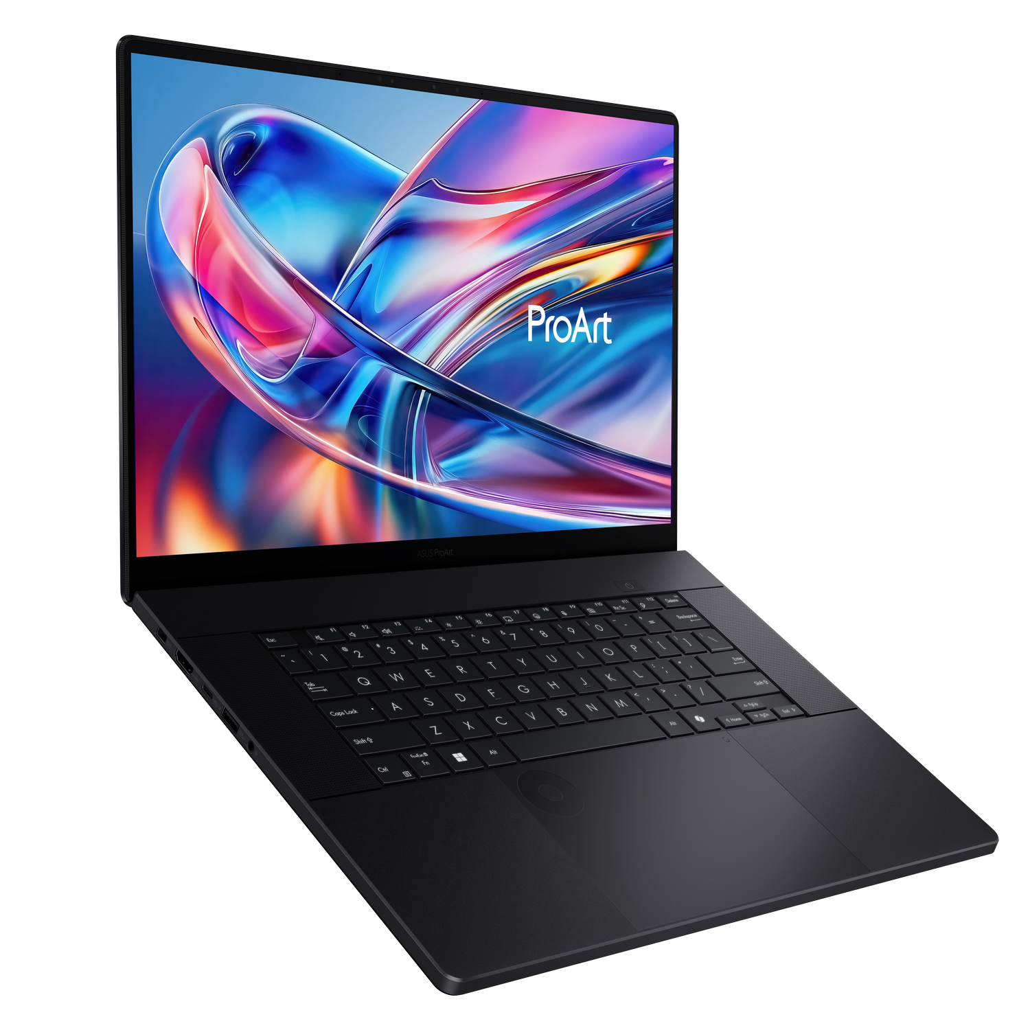 Una laptop ASUS ProArt negra se muestra en ángulo. La pantalla muestra una imagen abstracta colorida. El teclado es visible.