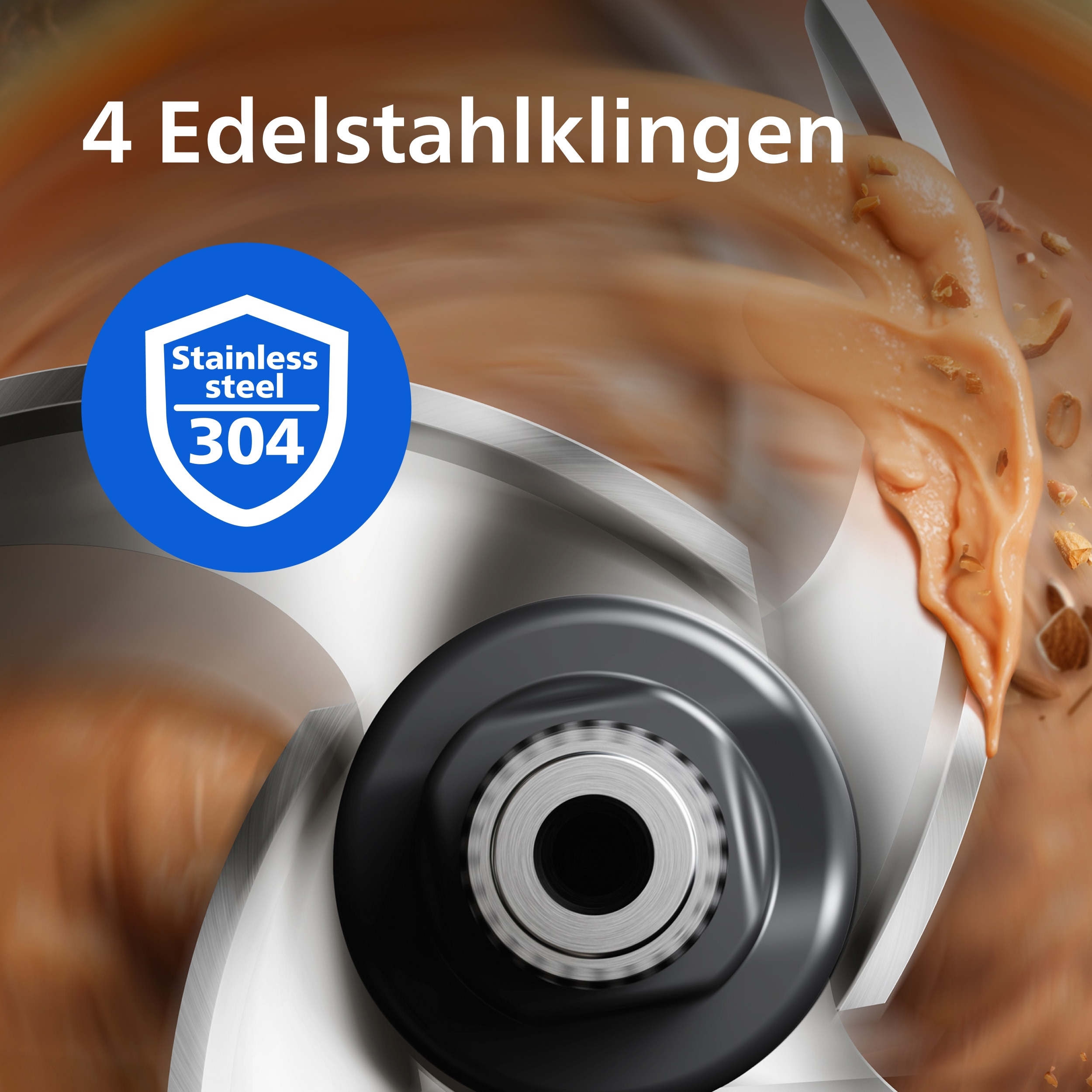 Das Bild zeigt einen Mixer mit Edelstahlklingen. Erdnussbutter und Nüsse sind im Hintergrund. Blaues Abzeichen mit Text.
