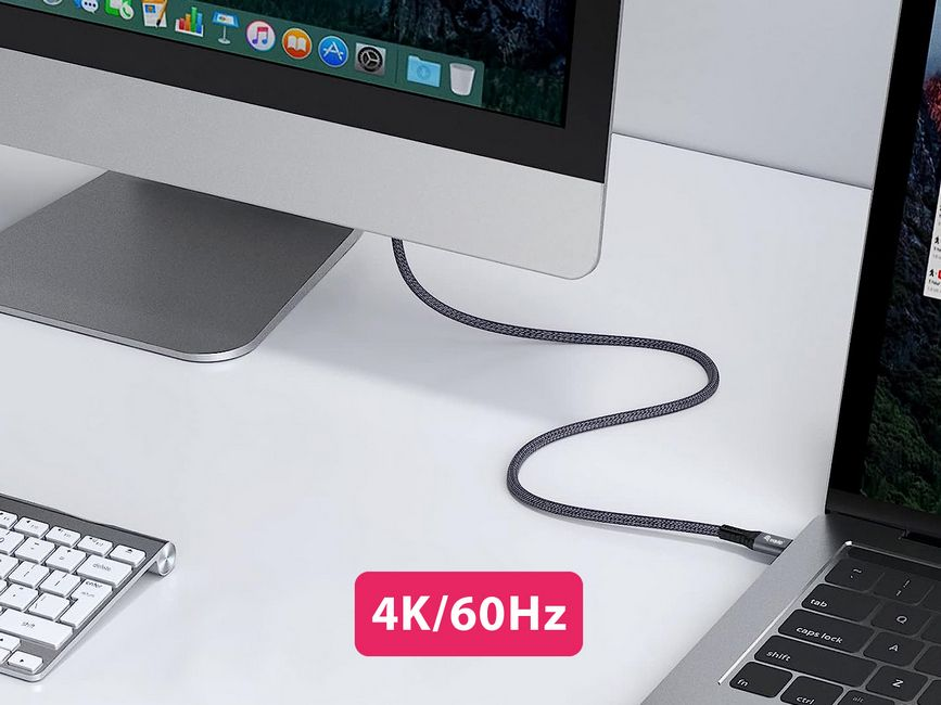 Ein Monitor und ein Laptop sind durch ein graues Kabel verbunden. Eine Tastatur ist sichtbar. Der Text '4K/60Hz' steht in einem rosa Feld.