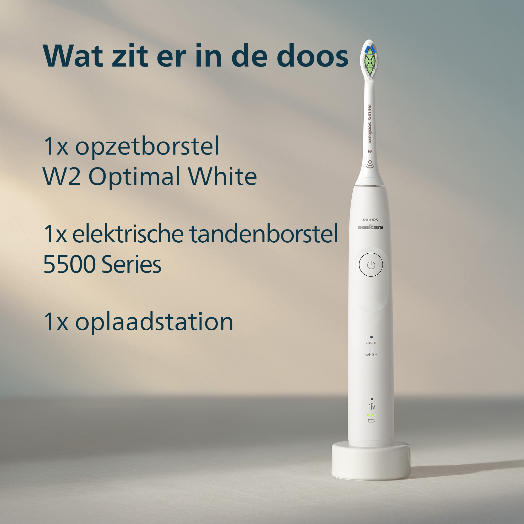 Een witte Philips Sonicare elektrische tandenborstel met een oplaadstation. Tekst geeft de items in de doos aan.