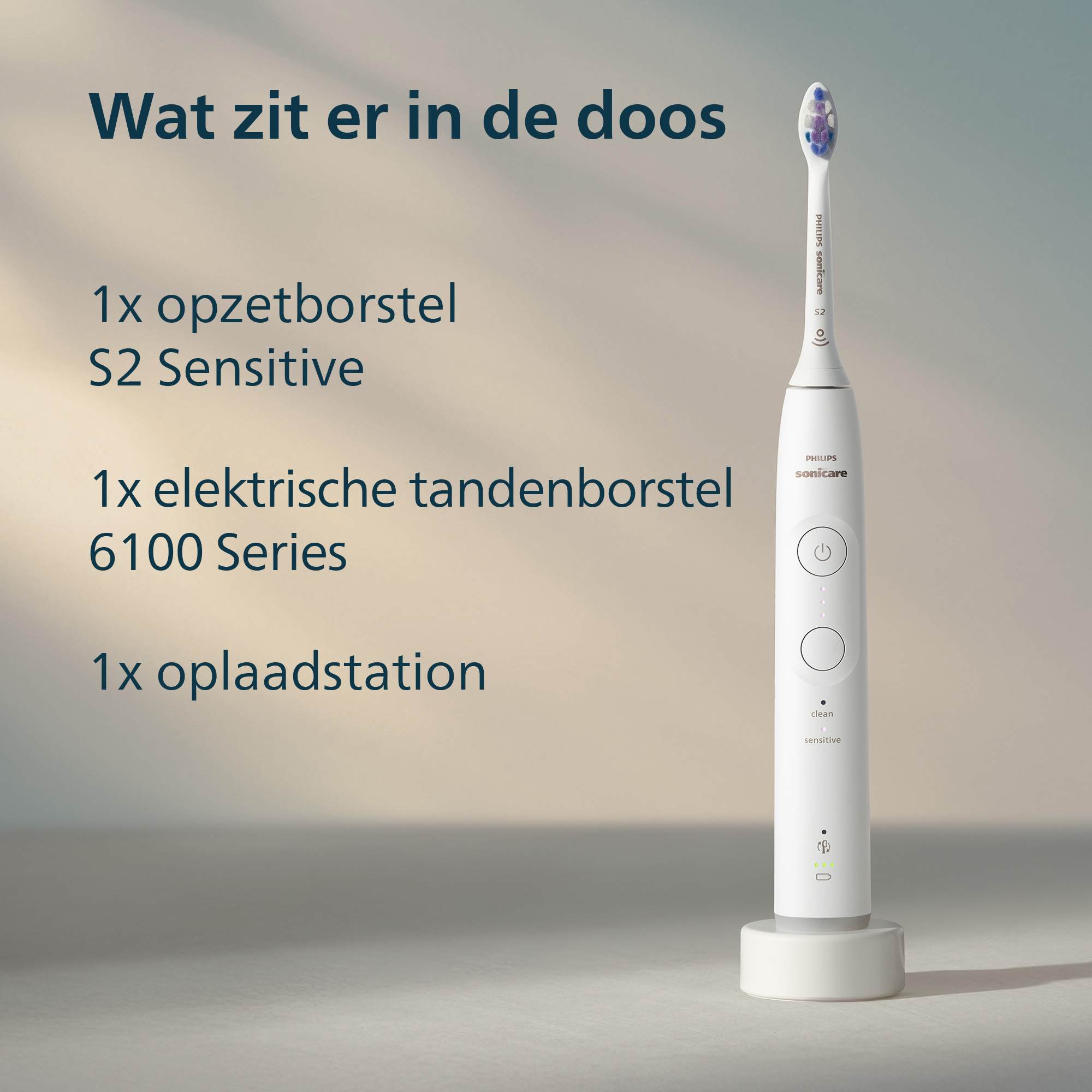 An electric toothbrush with a brush head, a charging station, and text in Dutch: What's in the box? S2 Sensitive and 6100 Series.