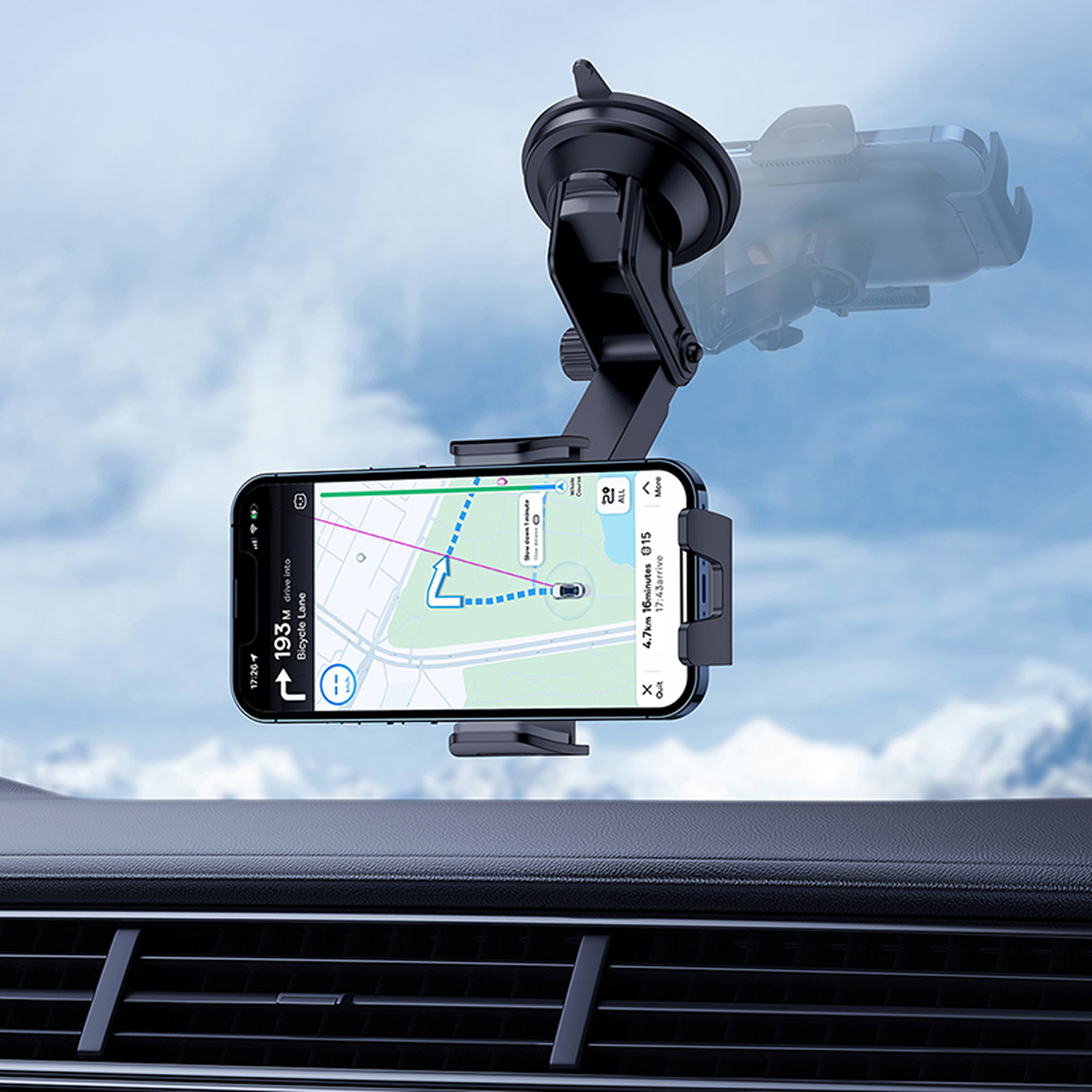 Un teléfono en un soporte para automóvil muestra una aplicación de navegación. El tablero es visible abajo y un cielo nublado en el fondo.