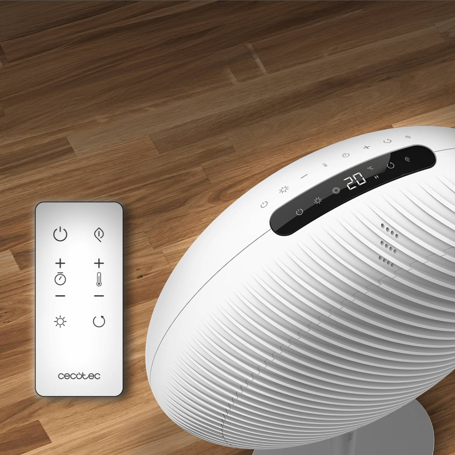 Un calentador blanco y un mando a distancia sobre un suelo de madera. El calentador tiene pantalla digital y botones.