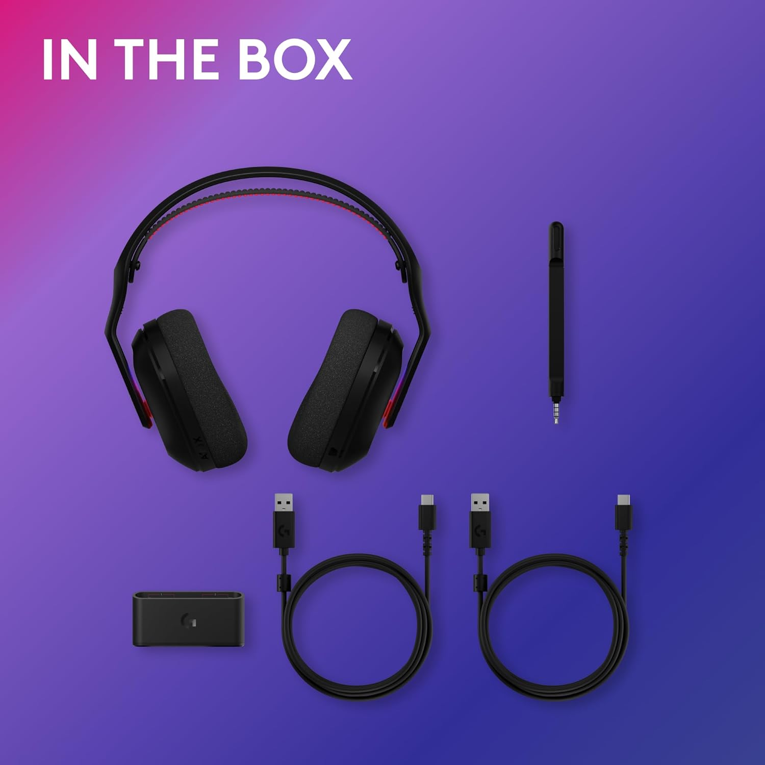 Casque de jeu noir, câbles et un émetteur sont affichés sur un fond dégradé violet-bleu. Le texte 'IN THE BOX' est en haut.