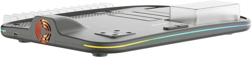 Una estación de carga de consola de juegos negra con iluminación RGB. Tiene un ventilador, ranuras de carga y un panel de control pequeño.