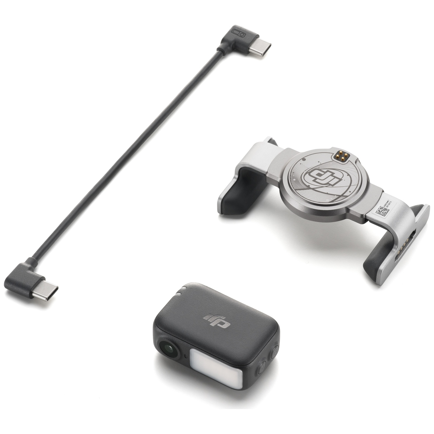 Three tech devices on white background. A black cable, a silver and black device, and a small black camera-like object.