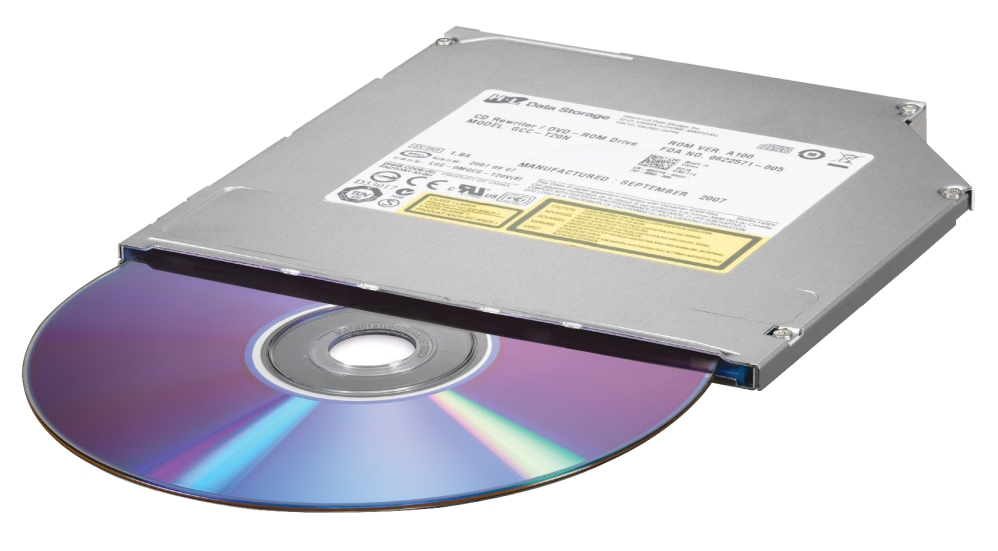 Ein CD-ROM-Laufwerk mit teilweise eingelegter Disc. Das Laufwerk ist silberfarben, die Disc spiegelt sich in Lila und Blau.