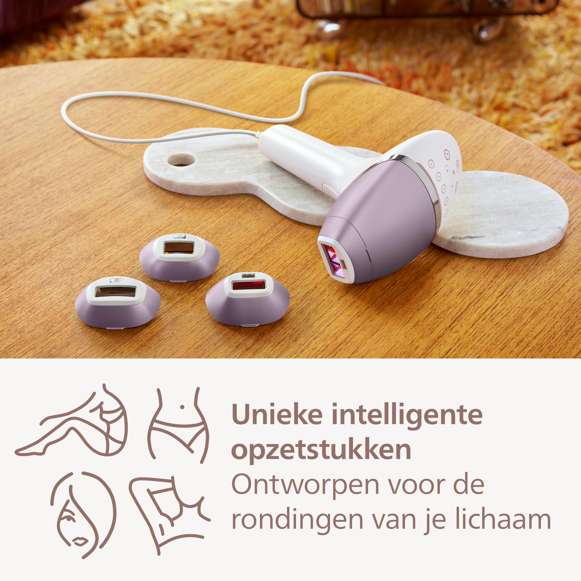 A hair removal device with three heads, sitting on a wooden table, next to a marble coaster. Text and icons are also present.