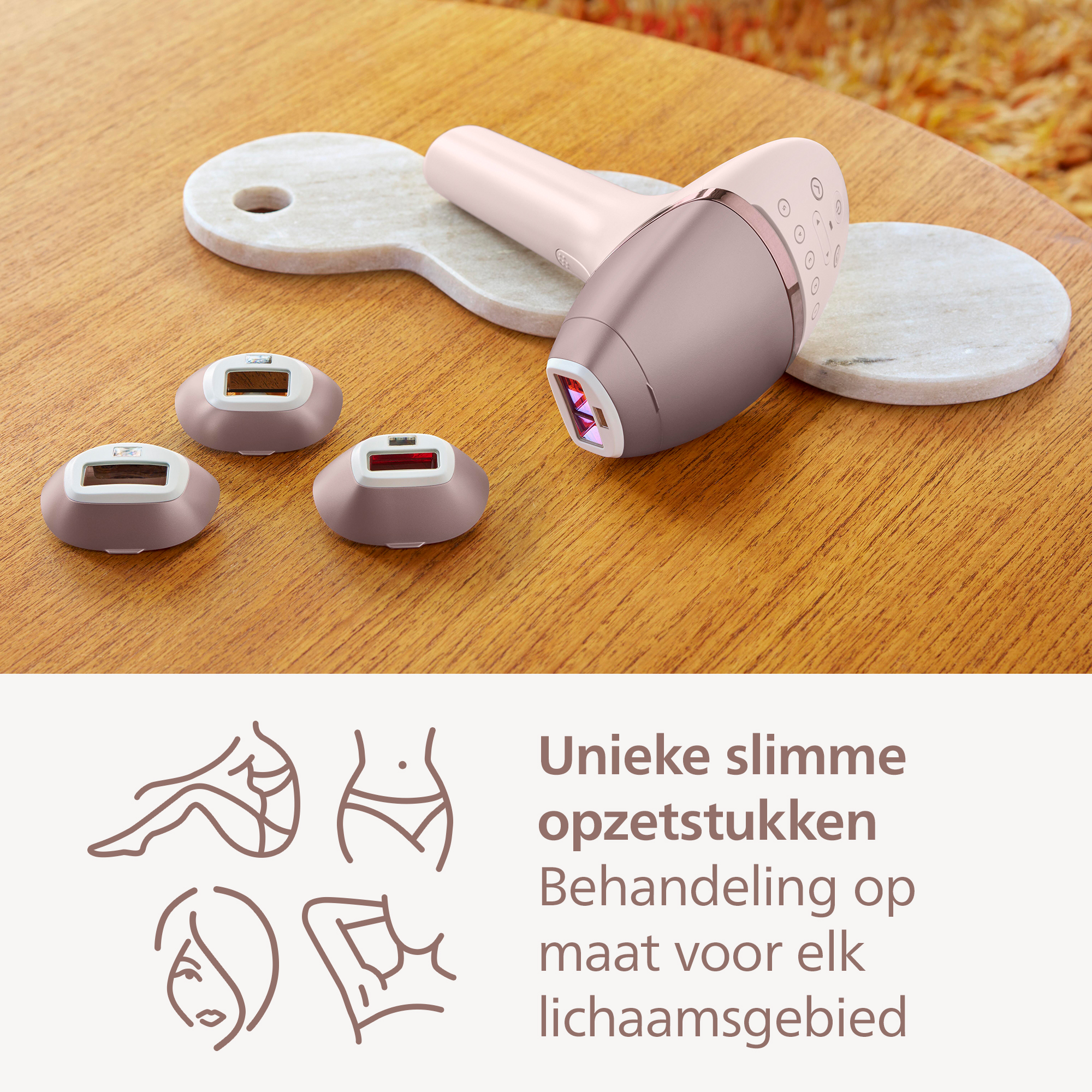 An epilator with three heads and a device on a wooden table. Text says: Unique smart attachments, treatment tailored to each body area.