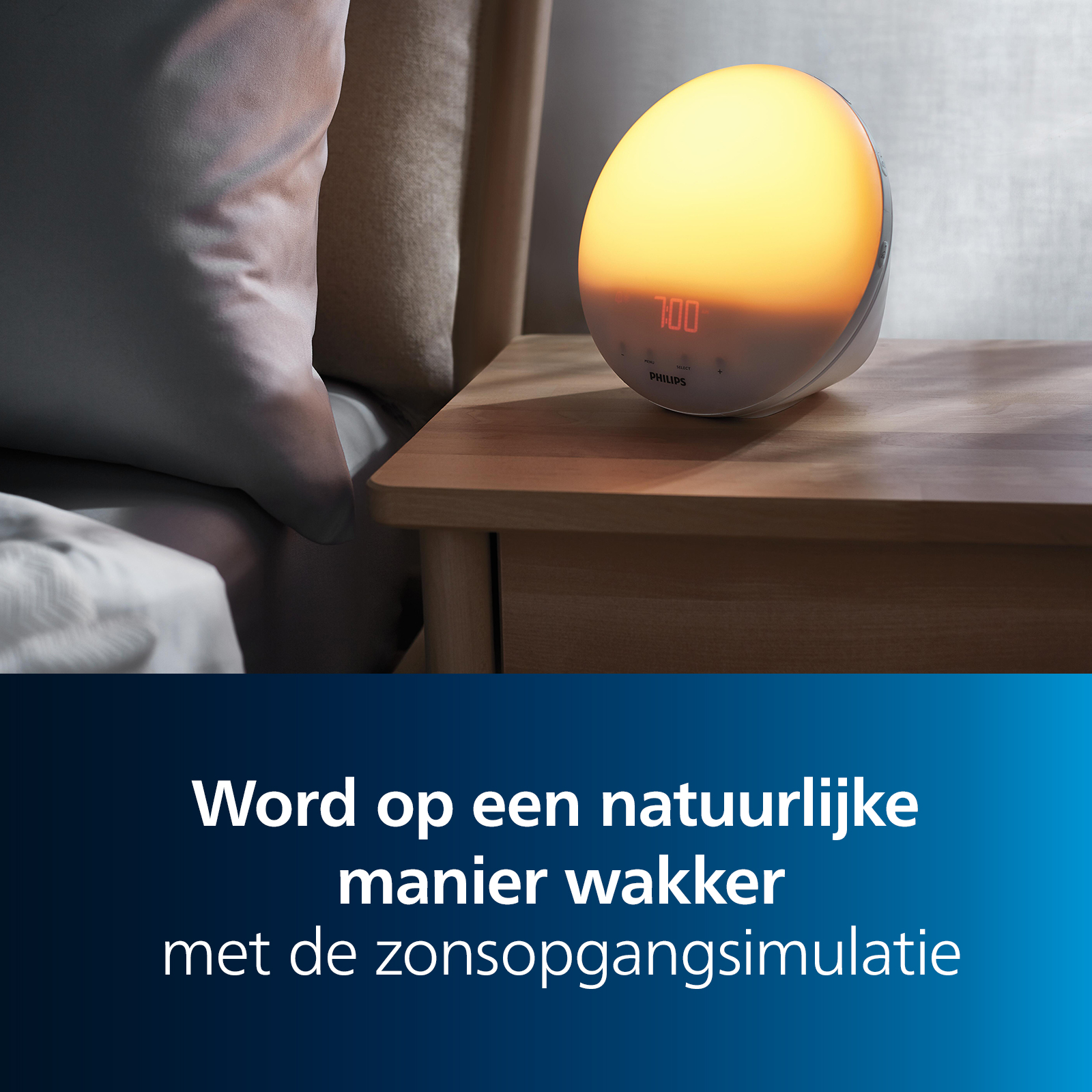 A Philips wake-up light on a nightstand shows 7:00. A bed and pillows are on the left. Text: Wake up naturally.