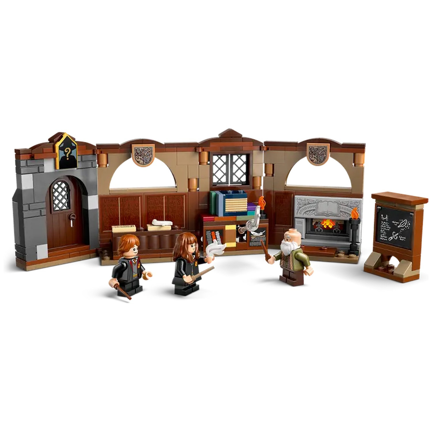 Lego set depicting a classroom scene with three minifigures, a fireplace, and a blackboard. Figures hold wands.