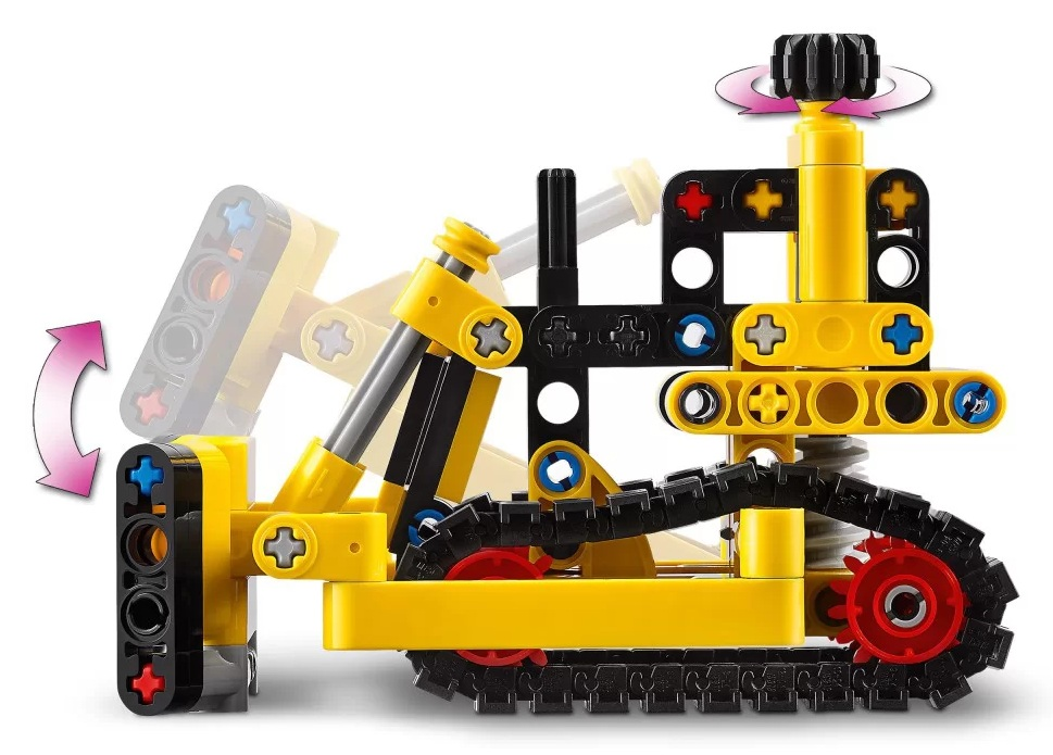 Żółto-czarna zabawka konstrukcyjna z obracającymi się kołami zębatymi. Gąsienice są czarne, a strzałki wskazują ruch.