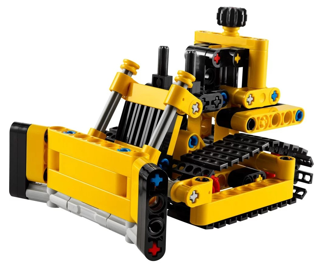Żółto-czarny model spychacza Lego Technic. Z przodu ma lemiesz, z tyłu gąsienice, na białym tle.