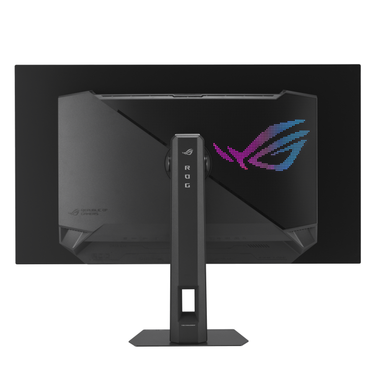 La parte trasera de un monitor de computadora negro. Tiene un soporte, un logotipo y las palabras ROG. El fondo es negro sólido.