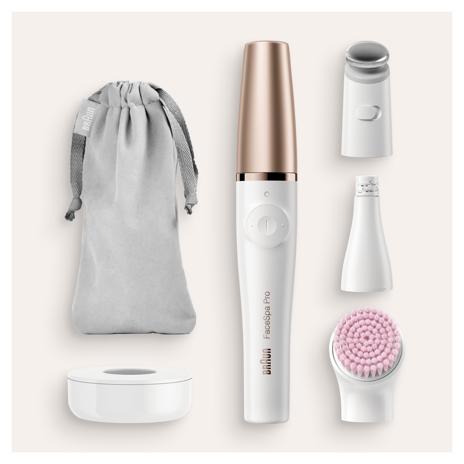 Un dispositivo Braun FaceSpa Pro y accesorios están organizados. Incluye un cepillo, una bolsa de almacenamiento, un soporte de carga y varios accesorios.