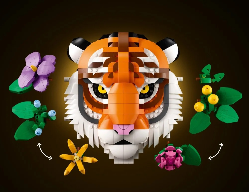 Głowa tygrysa Lego z pomarańczowymi, białymi i czarnymi paskami. Wokół kwiaty i liście Lego w różnych kolorach.