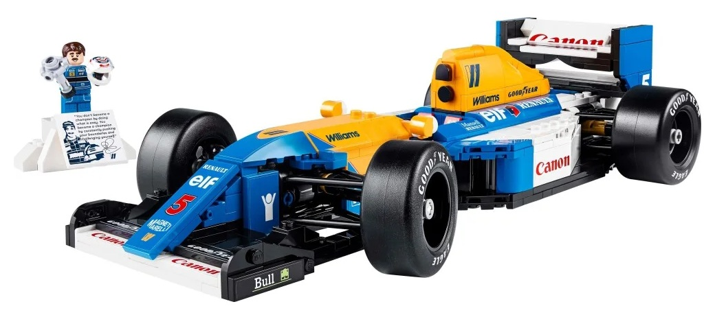 Model samochodu F1 Lego, niebiesko-żółty, z figurką Lego trzymającą kask. Loga to m.in. Williams, Renault i Canon.