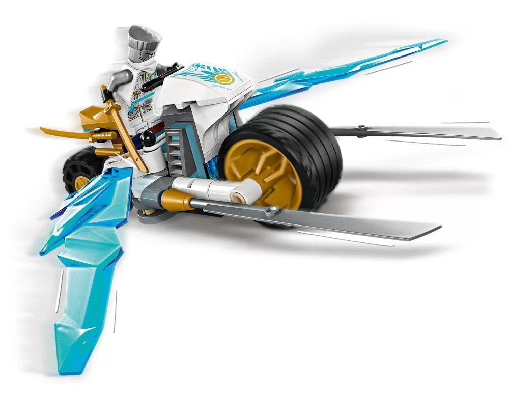 Motocykl Lego w biało-niebieskim designie, minifigurka na nim. Tło jest białe.