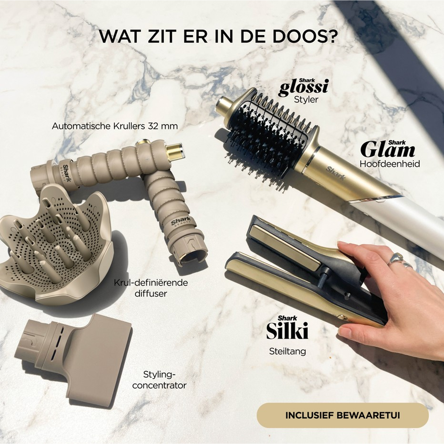 Haarstyling tools set: styler, stijltang, diffuser, krultangen en concentrator op marmer. Inclusief een opbergcase.