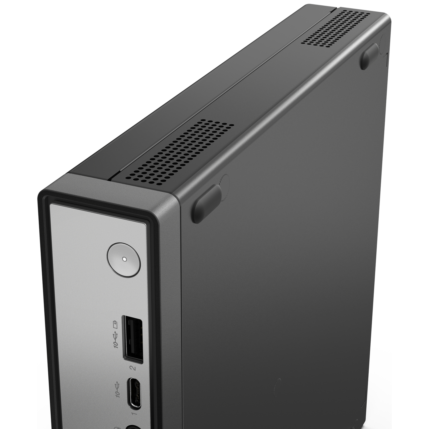 A dark gray computer case with ventilation holes and ports. The front panel is silver. The case is angled towards the viewer.