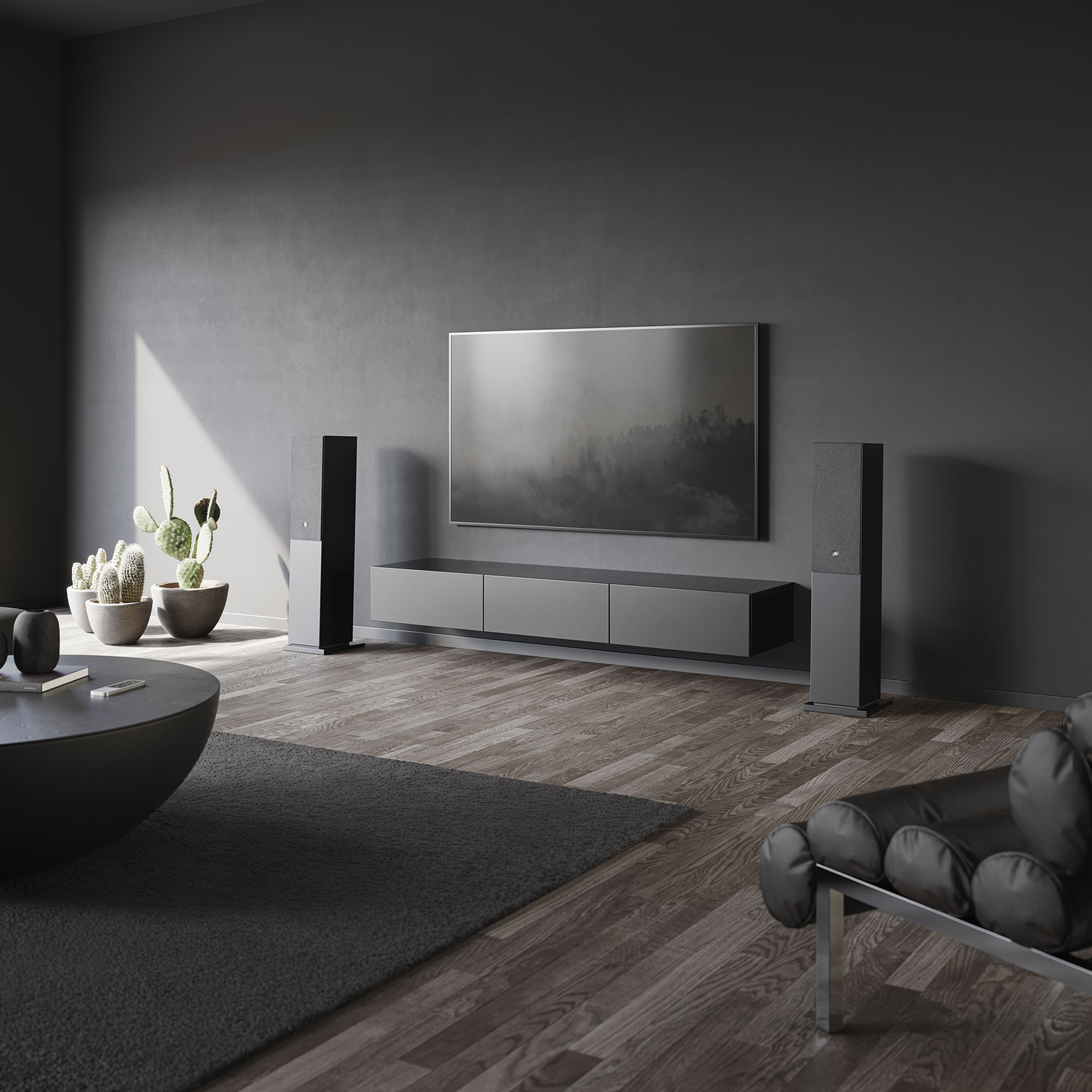 A modern living room with gray walls and furniture. A TV, speakers, a sofa, a coffee table, and a rug are present.