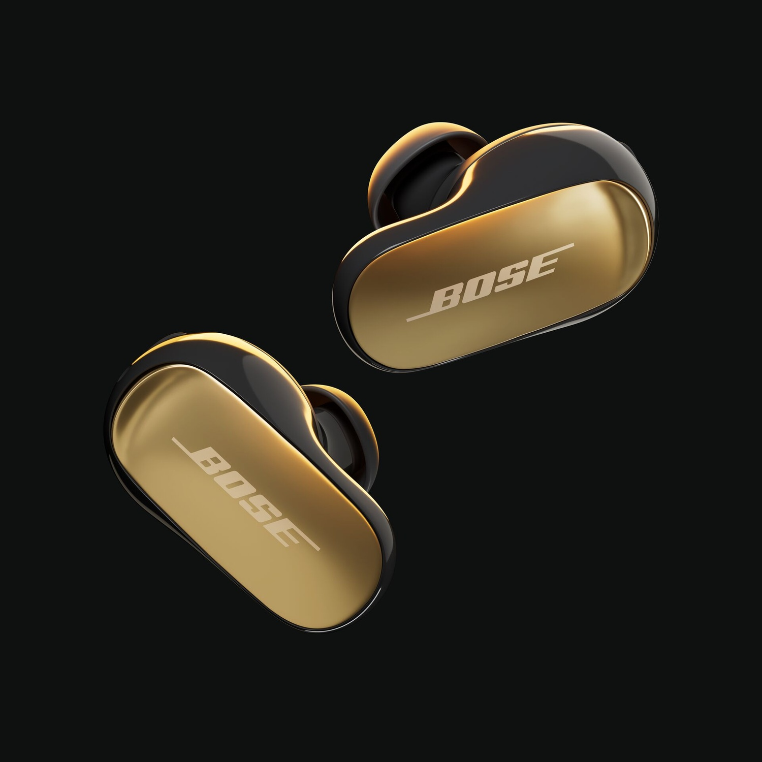 Due auricolari wireless Bose, oro e neri, fluttuano su sfondo nero. Ognuno mostra il logo Bose.