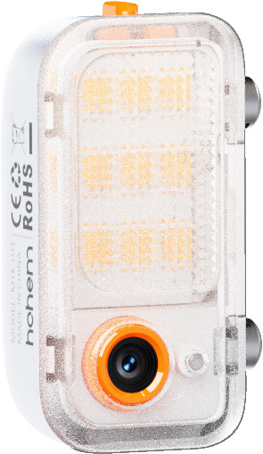Ein weißes und klares elektronisches Gerät mit einem orangefarbenen Kameraobjektiv und einer Taste. Das Gerät hat eine Reihe kleiner Lichter.