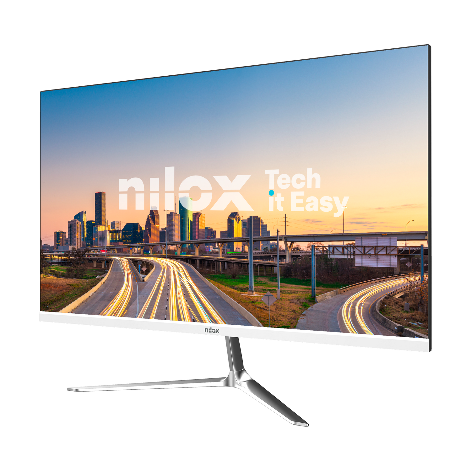 Un monitor de computadora muestra un paisaje urbano con autopistas y rastros de luz. El monitor tiene un soporte plateado y un marco blanco.