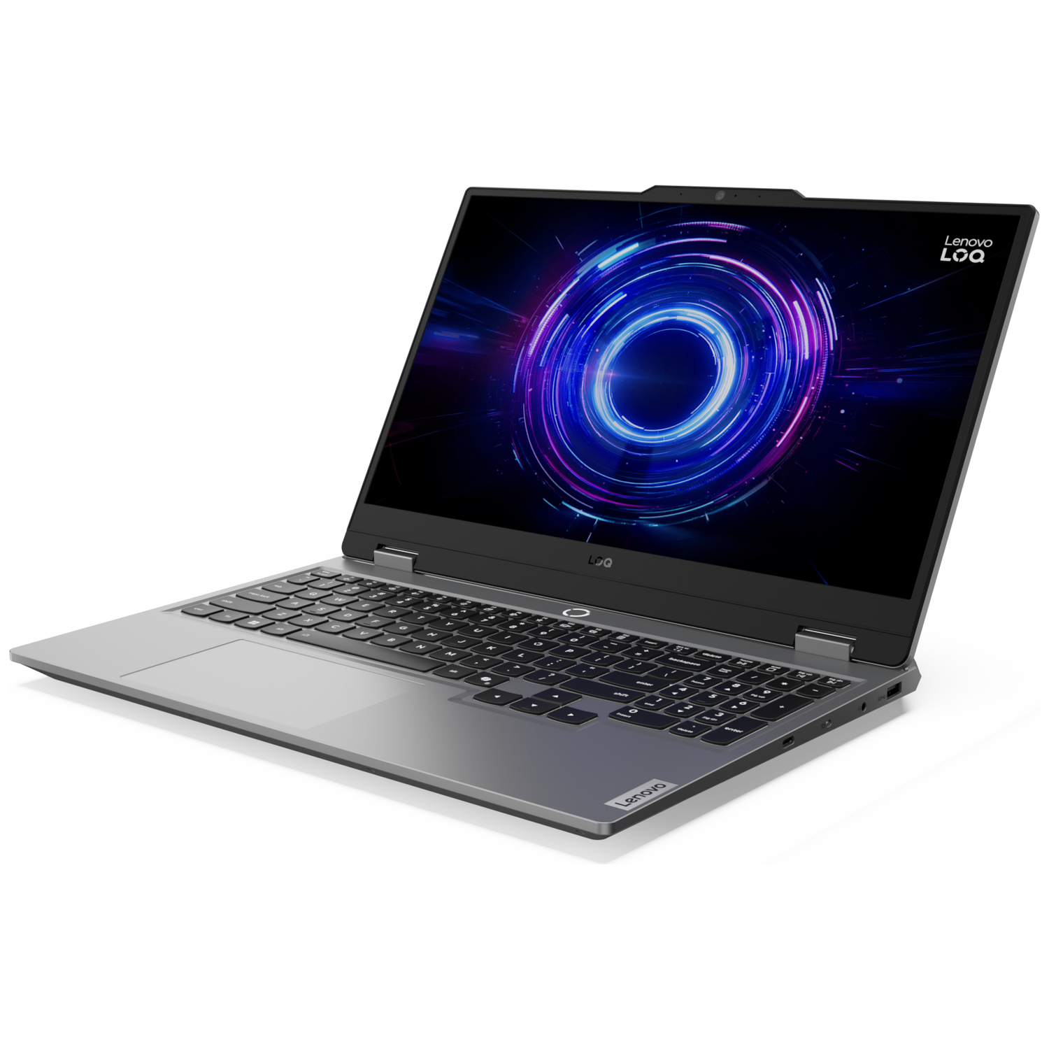 A Lenovo laptop is on a white surface. The screen displays a blue and purple circular design. The keyboard is black.