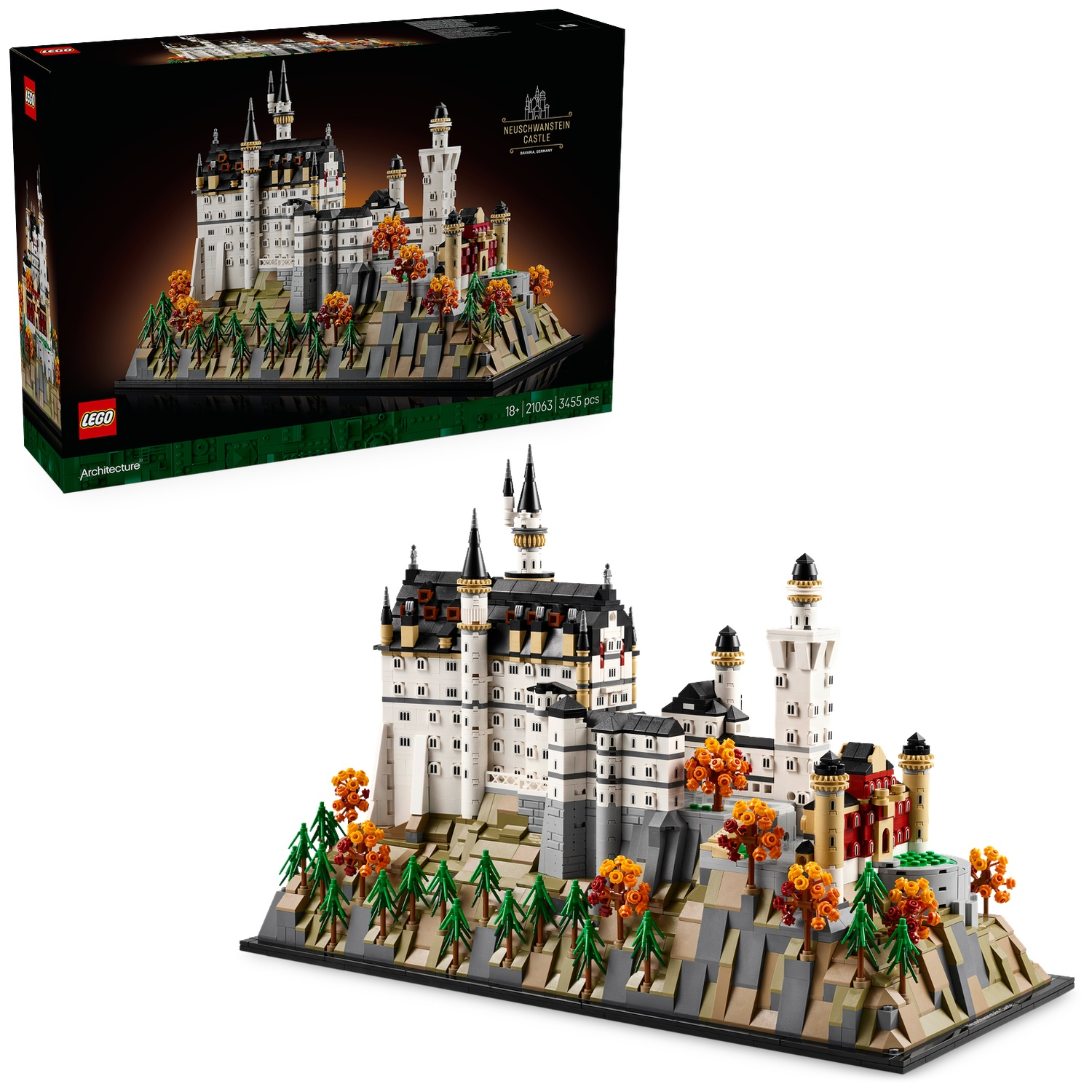 Lego model of Neuschwanstein Castle on a rocky base, with trees and a box in the background.