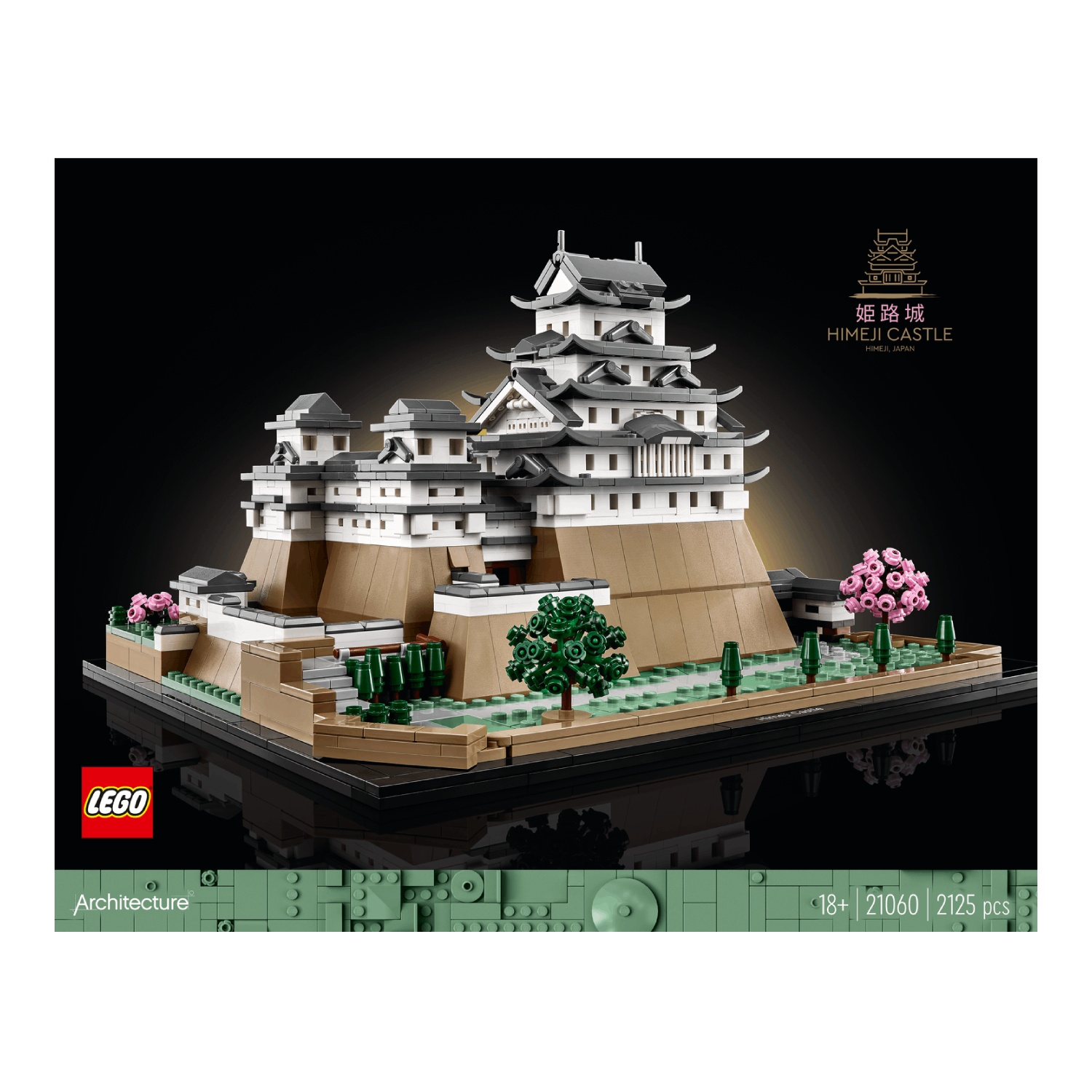 Een Lego-model van kasteel Himeji. Het kasteel is wit en grijs met bruine bases. Het staat op een zwarte basis met bomen en bloemen.