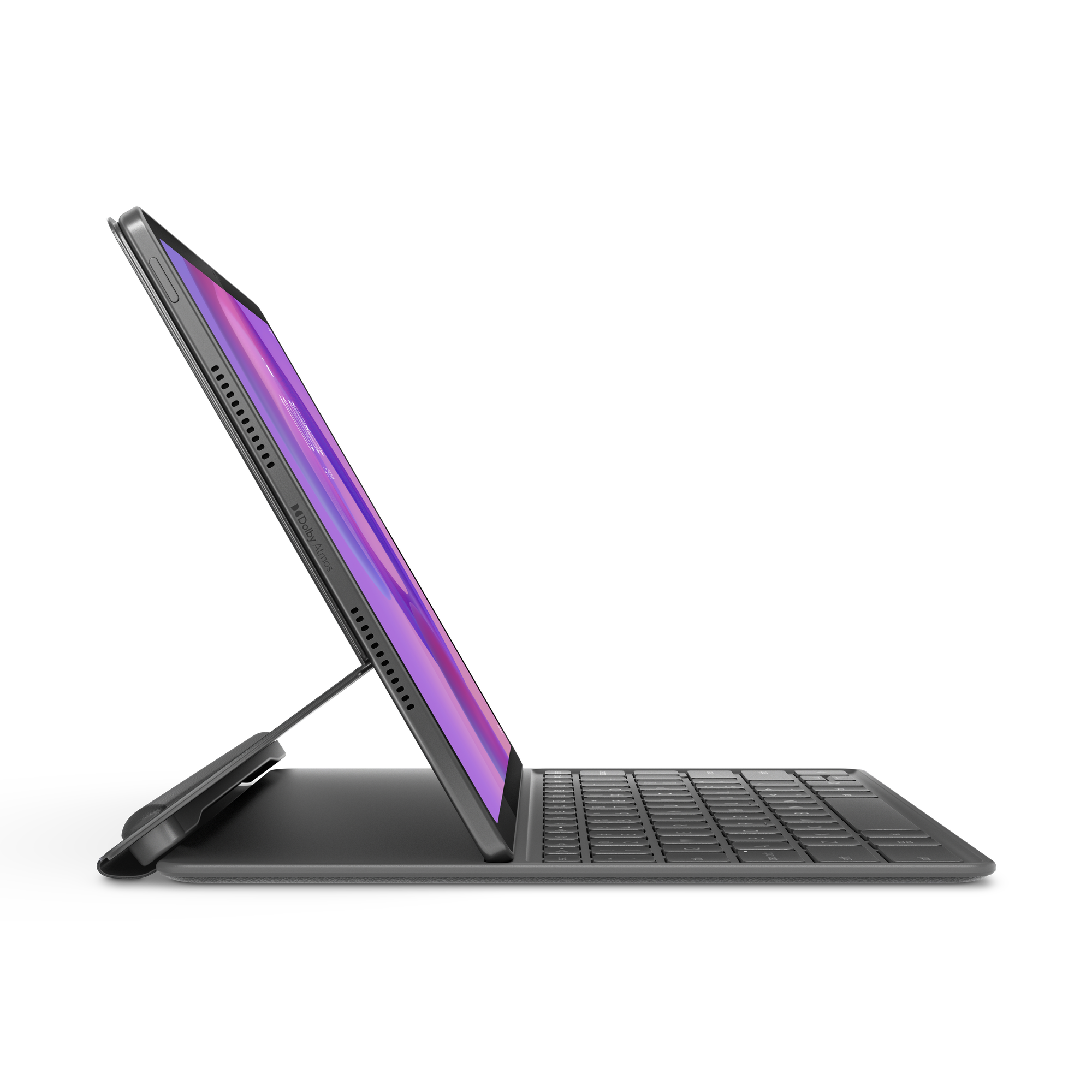 Karanlık bir ortamda klavyeli tablet. Ekran mor ve açılı. Klavye siyahtır.