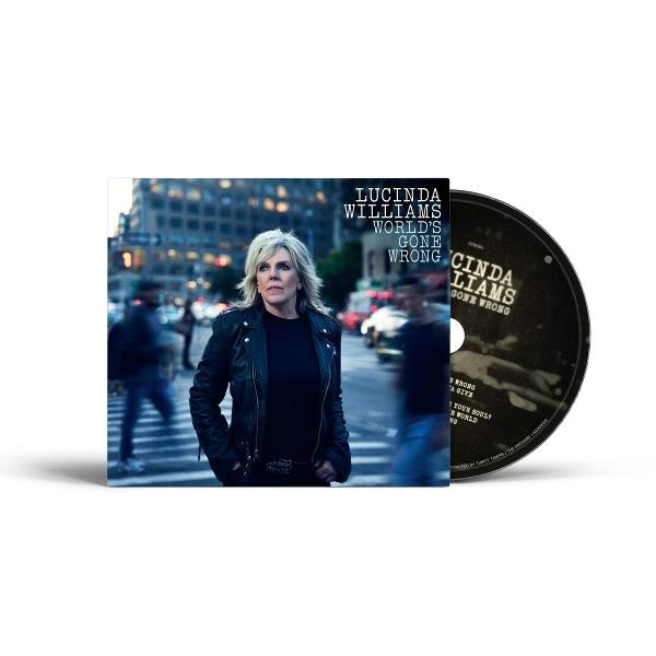 Lucinda Williams Album 'World's Gone Wrong'. CD und Coverbild. Williams in schwarzer Jacke auf einer Stadtstraße.