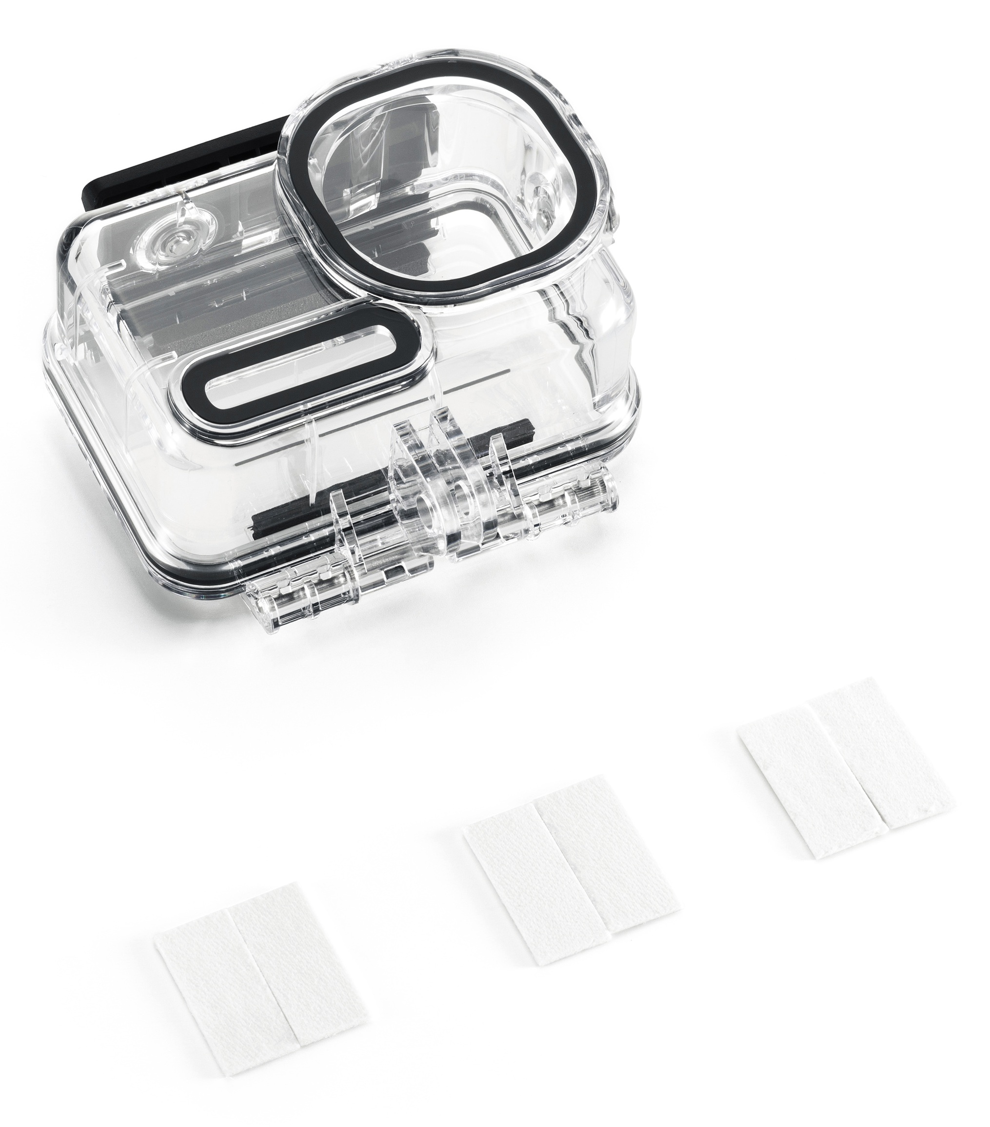 Przezroczysta, prostokątna wodoszczelna obudowa aparatu z czarnymi uszczelkami i trzema białymi podkładkami, wszystko na białym tle.