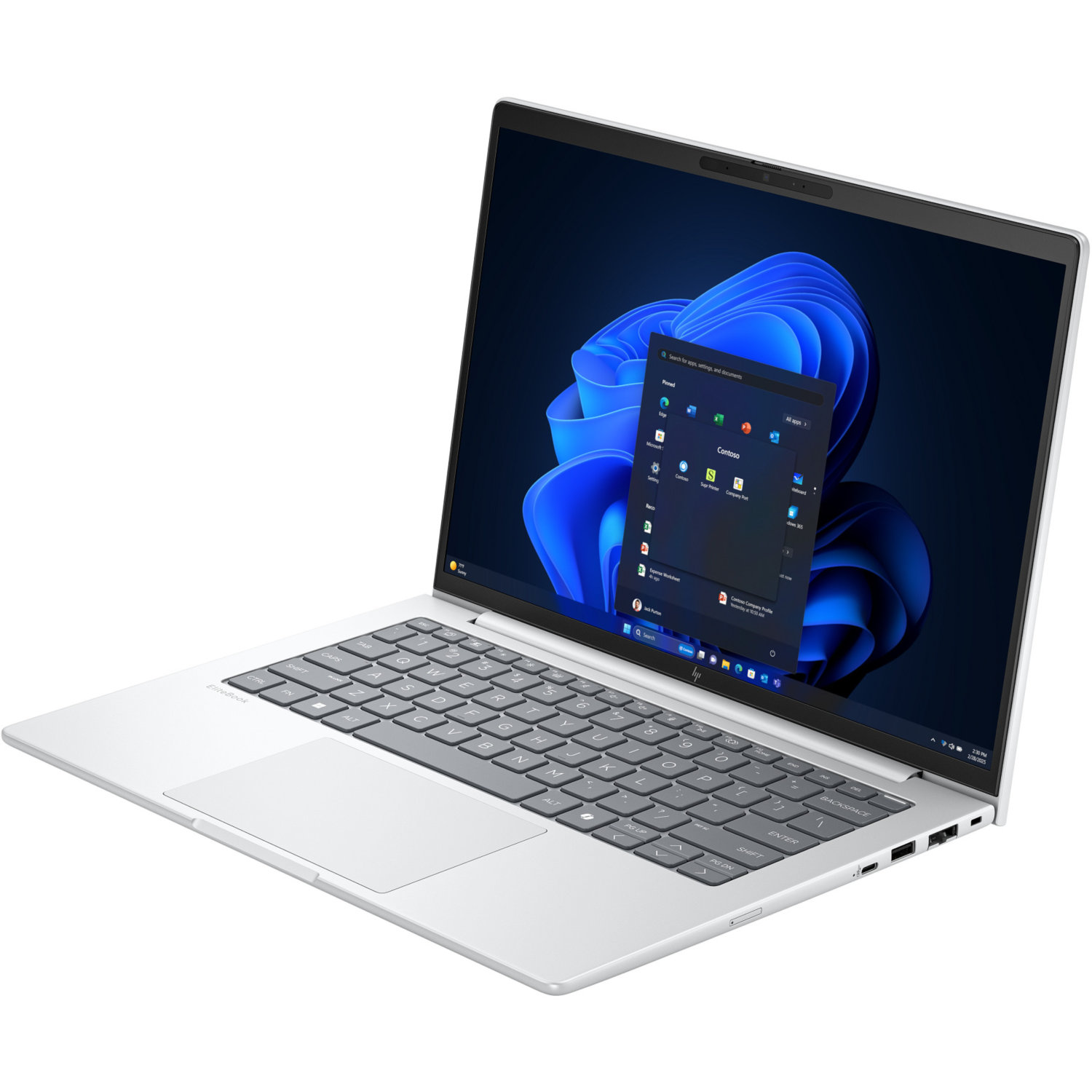 Silver laptop open, displaying a Windows interface. The keyboard is visible, with the screen showing app icons and a blue background.